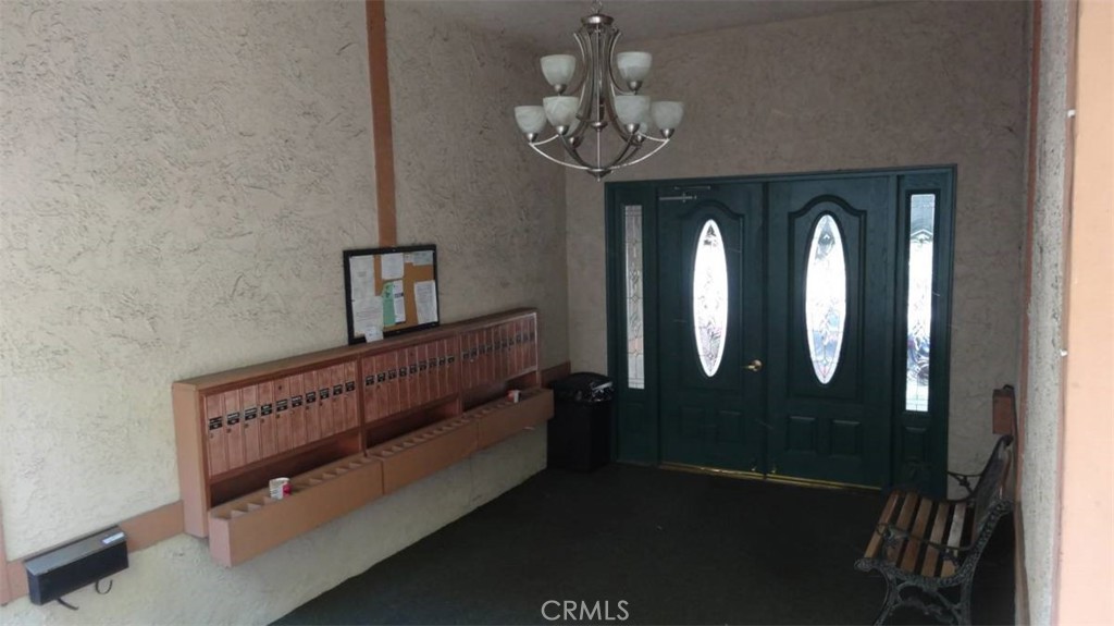 12030 Rochester Avenue, Unit 110 Los Angeles, CA 90025 - Photo 3 of 4 a view of hall way with mirror