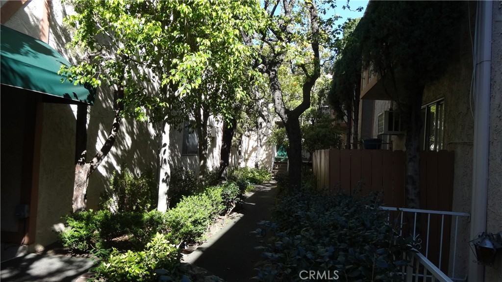 12030 Rochester Avenue, Unit 110 Los Angeles, CA 90025 - Photo 4 of 4 a view of backyard of house with green space