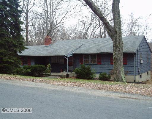 43 Quaker Ridge Road Shelton, CT 06484 - Photo 1 of 1 a front view of a house with a yard and garage