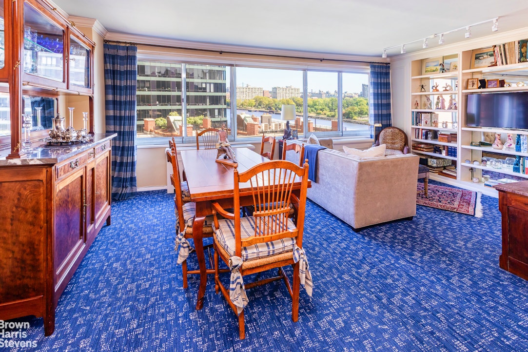 530 East 72nd Street, Unit 9B Manhattan, NY 10021 - Photo 2 of 18 a living room with fireplace furniture and a large window
