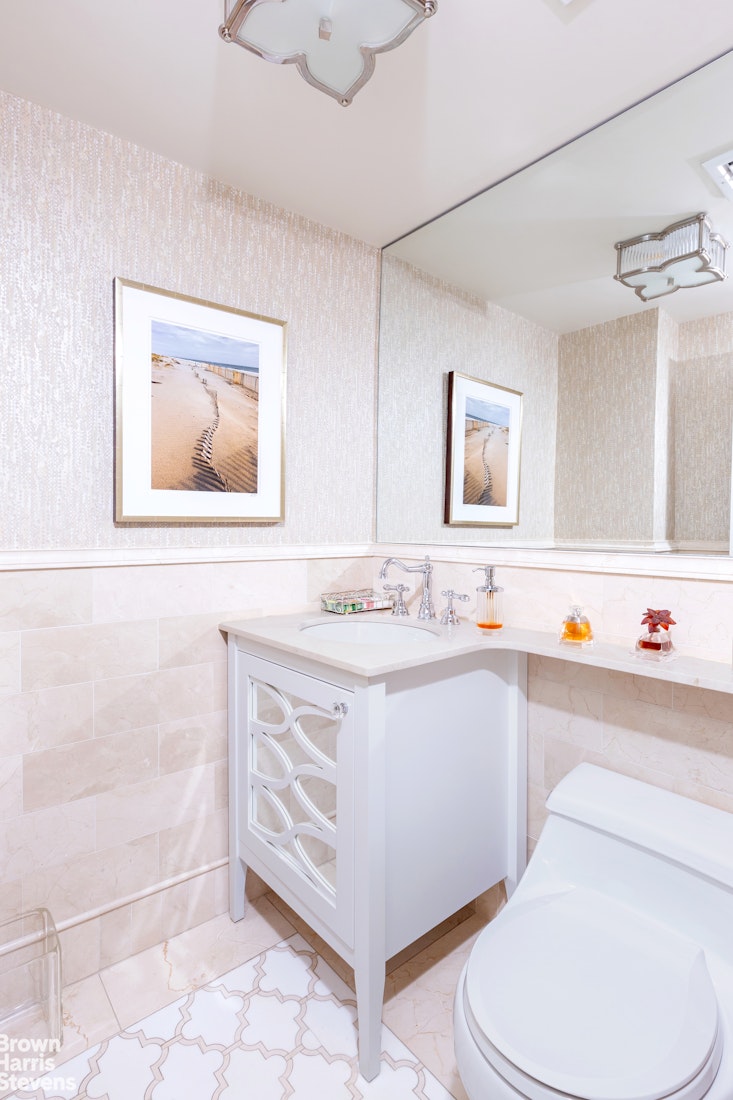 530 East 72nd Street, Unit 9B Manhattan, NY 10021 - Photo 8 of 18 a bathroom with a sink a toilet and a bathtub