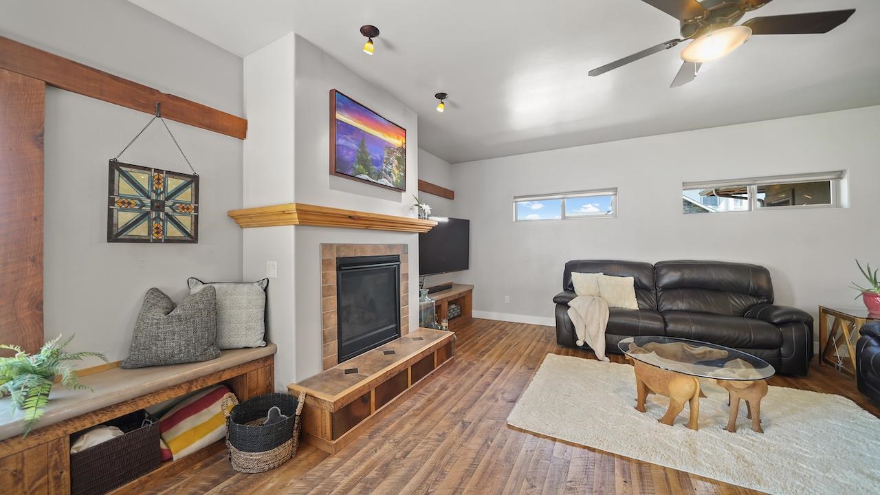 949 Kayenta Way Fruita, CO 81521 - Photo 12 of 41 a living room with furniture and a fireplace