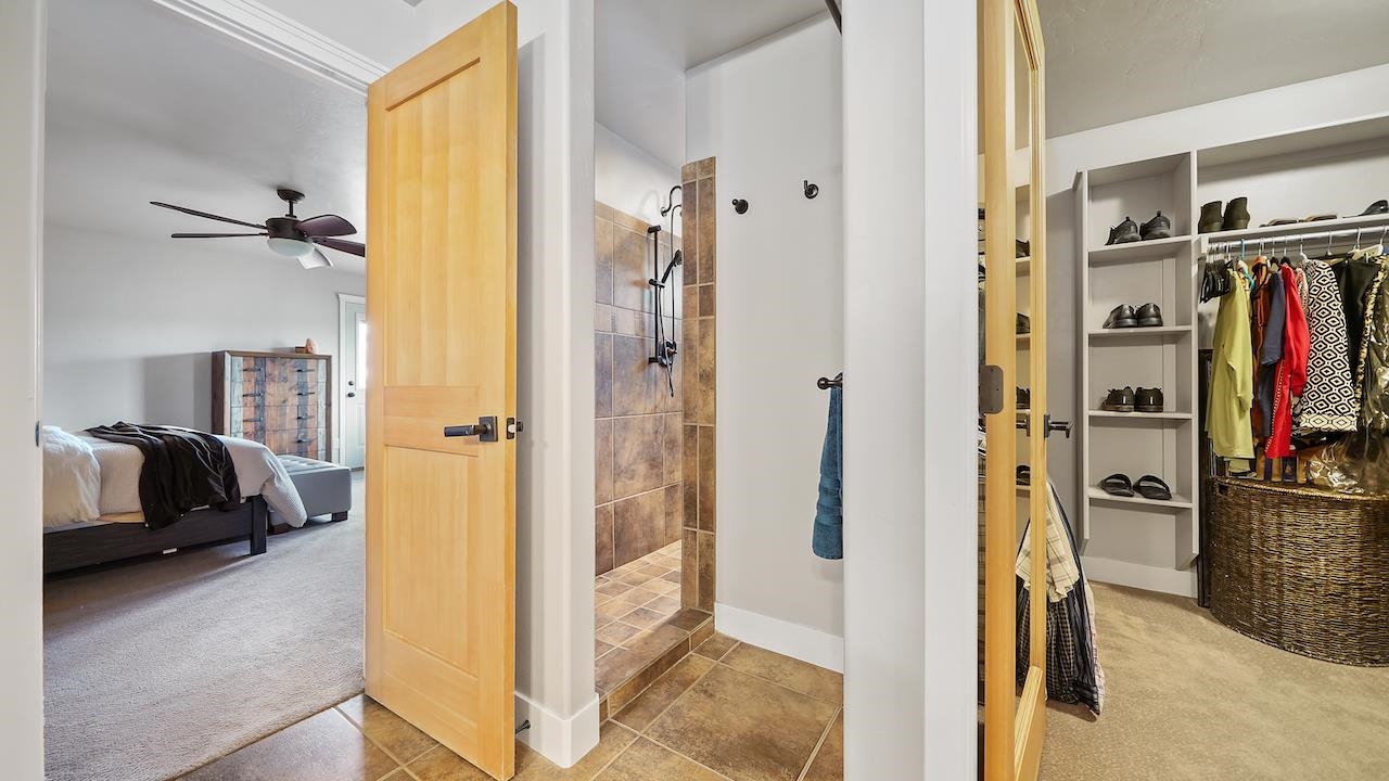 949 Kayenta Way Fruita, CO 81521 - Photo 18 of 41 a view of walk in closet with clothes and shoes