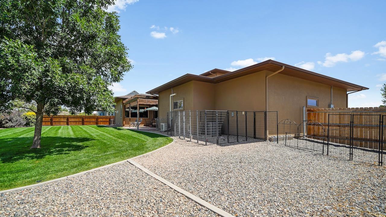 949 Kayenta Way Fruita, CO 81521 - Photo 36 of 41 a front view of a house with a yard and garage