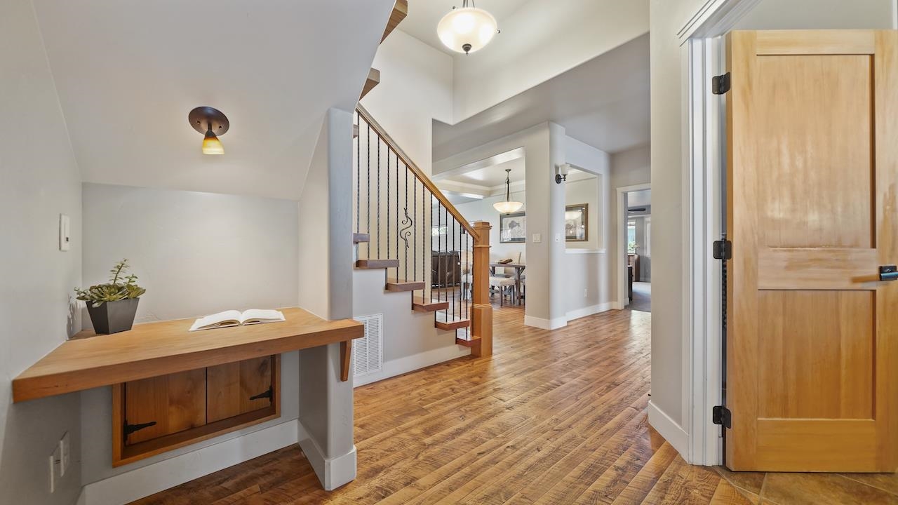 949 Kayenta Way Fruita, CO 81521 - Photo 7 of 41 a view of a hallway with wooden floor and staircase