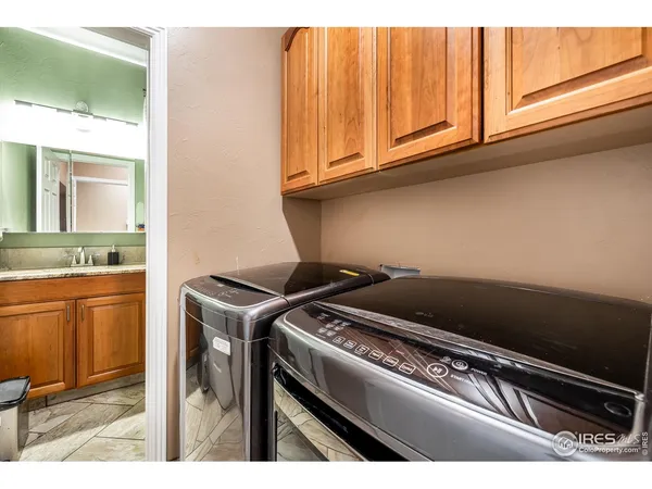 a room with lots of furniture and a wooden floor