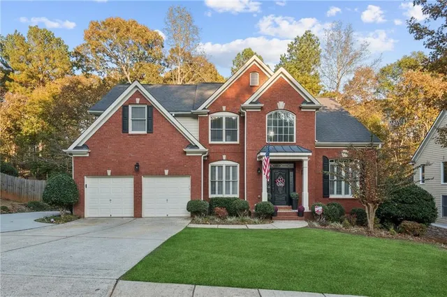 front view of a house with a yard