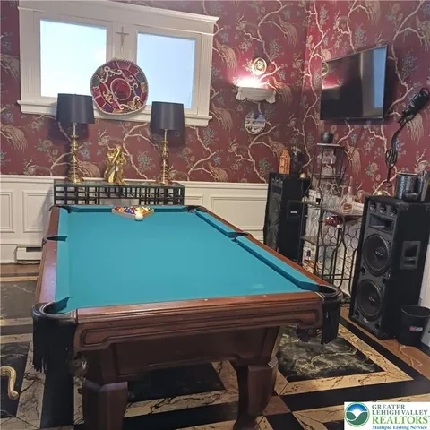 a view of a livingroom with furniture and hardwood floor