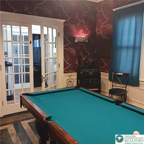 a bathroom with a sink a mirror and a toilet