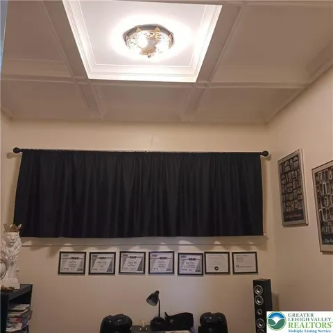 a view of a patio with table and chairs and wooden floor