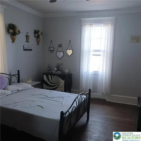 a bed room with a bed and a night stand