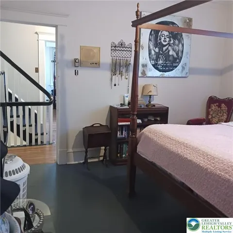 an empty room with wooden floor and closet