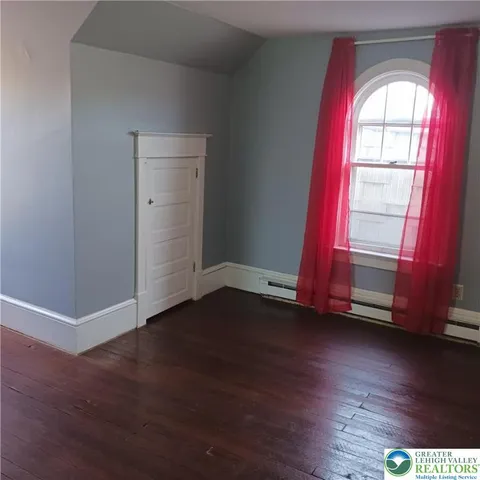 a view of entryway and kitchen