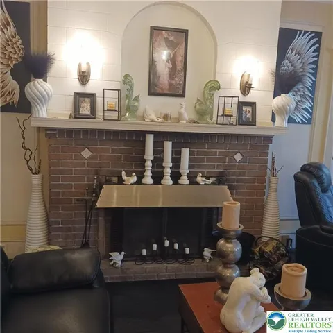 a room with water heater and wooden walls