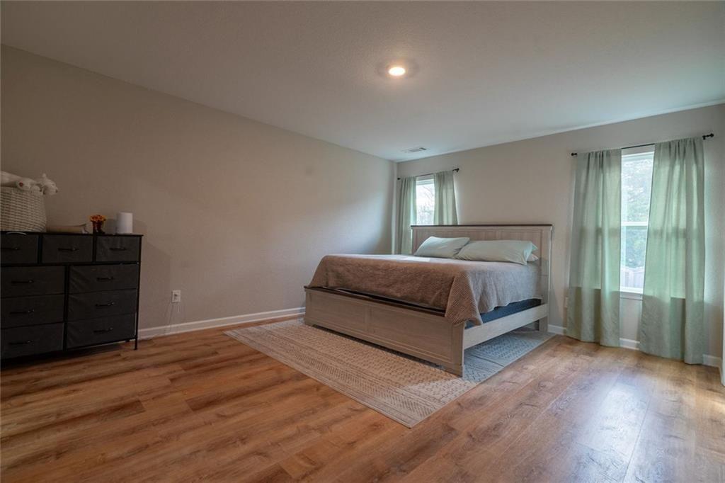 735 Walnut Creek Circle Pendergrass, GA 30567 - Photo 19 of 29 a bedroom with a bed and cabinet