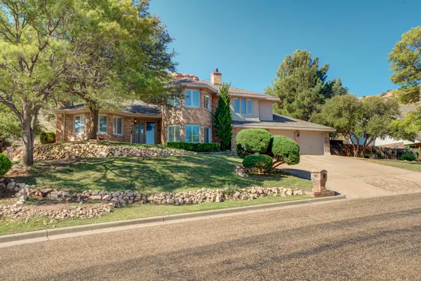 a kitchen with stainless steel appliances white cabinets and a granite counter tops