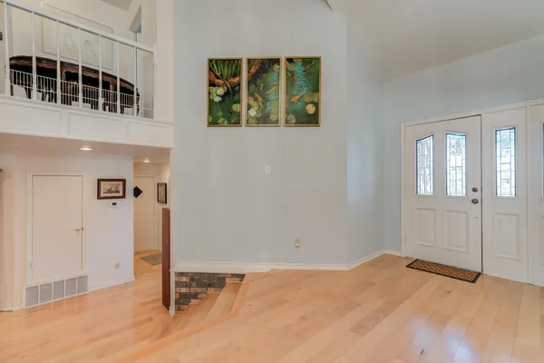 a kitchen with stainless steel appliances kitchen island granite countertop a refrigerator and a stove top oven