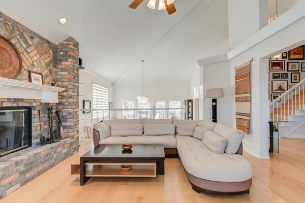 a view of a livingroom with couch and a window