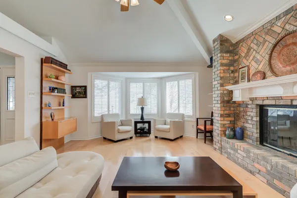 a view of a livingroom with workspace and a window