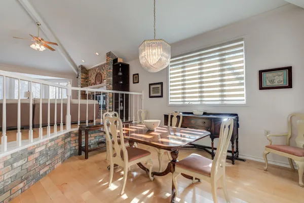 a view of a livingroom with furniture and hardwood floor