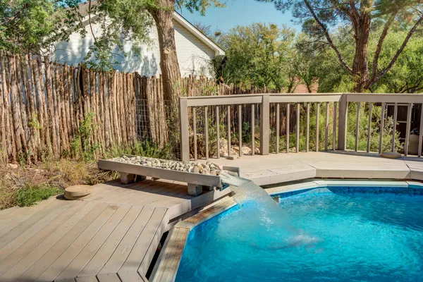 a view of house with a tree