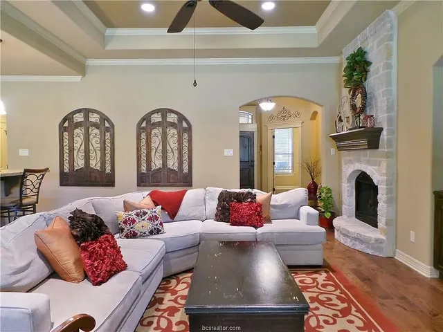 a living room with furniture and a fireplace