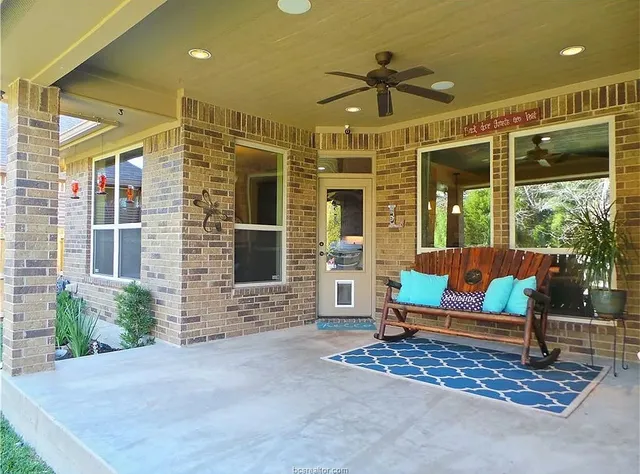 a kitchen with granite countertop a stove and a microwave