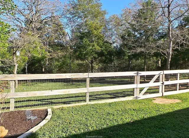 a view of a backyard with patio