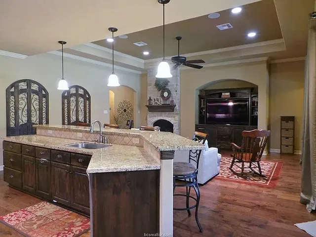a kitchen with a table and chairs in it