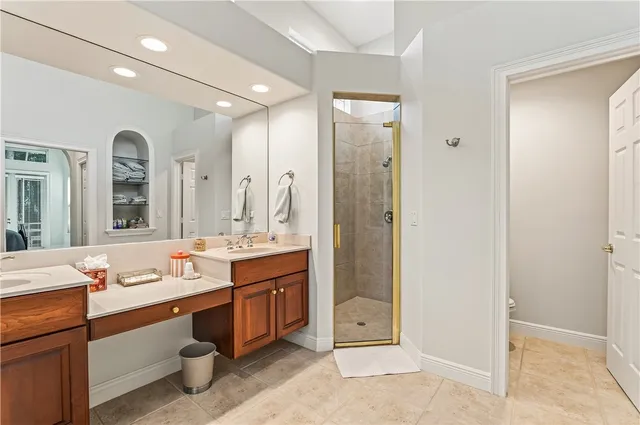 a bathroom with a double vanity sink mirror and double