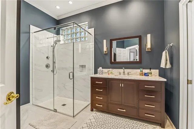 a bathroom with a sink a mirror and a shower