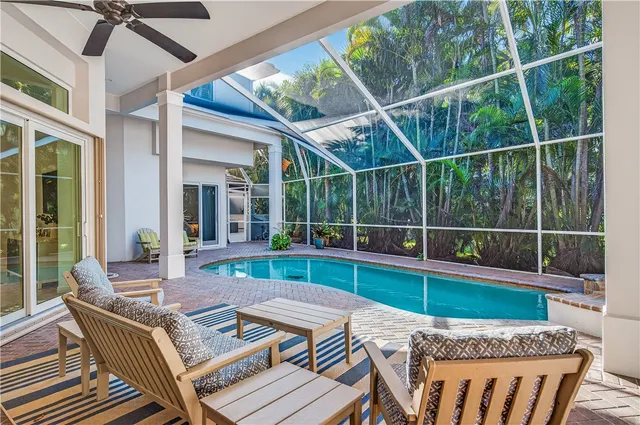 a view of a patio with a table chairs and balcony