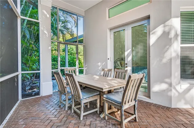 a view of a dining room with furniture and window