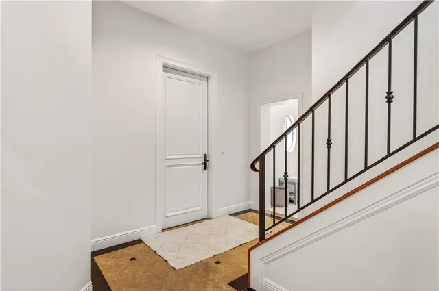 a view of an entryway with wooden floor