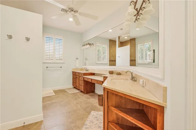 a bathroom with a sink double vanity and a mirror