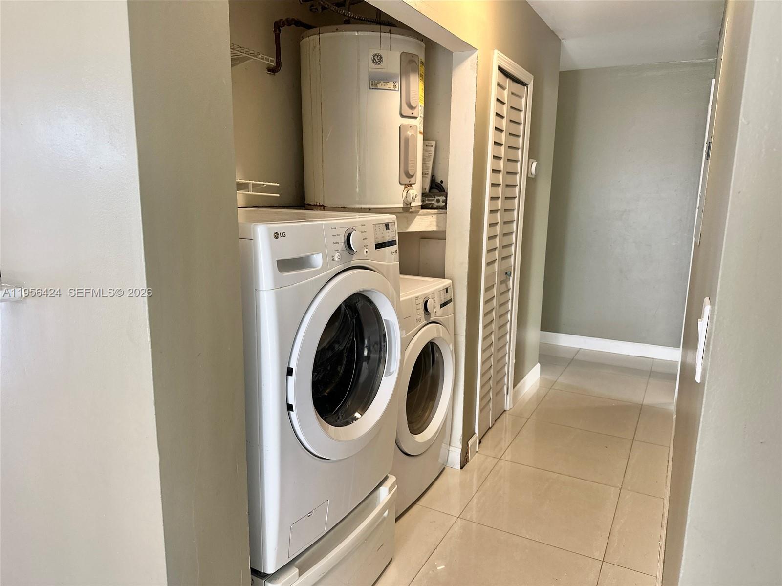 4249 Southwest 154th Avenue Miami, FL 33185 - Photo 11 of 24 a view of a hallway with washer and dryer