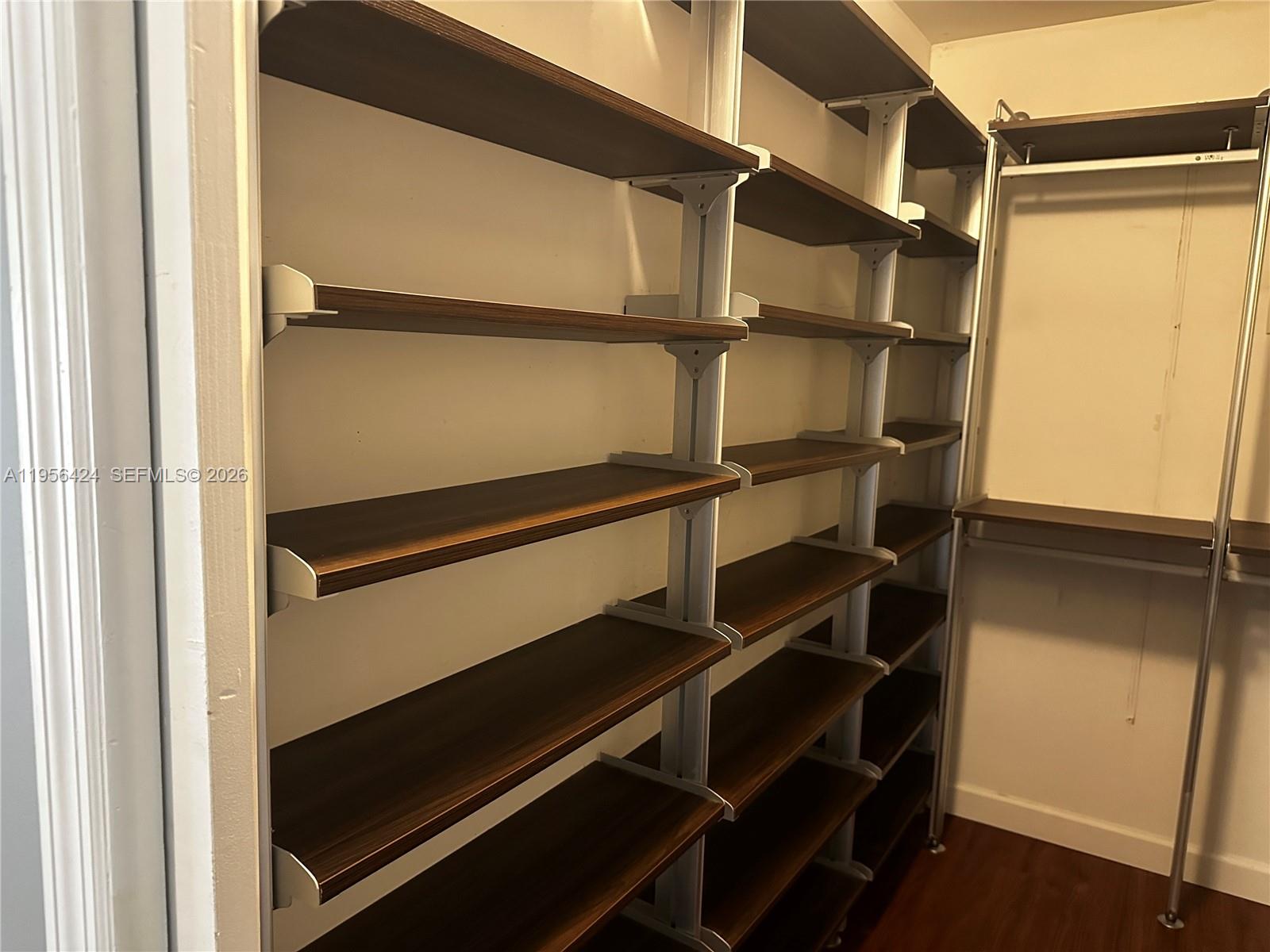 4249 Southwest 154th Avenue Miami, FL 33185 - Photo 15 of 24 a view of walk in closet with empty racks