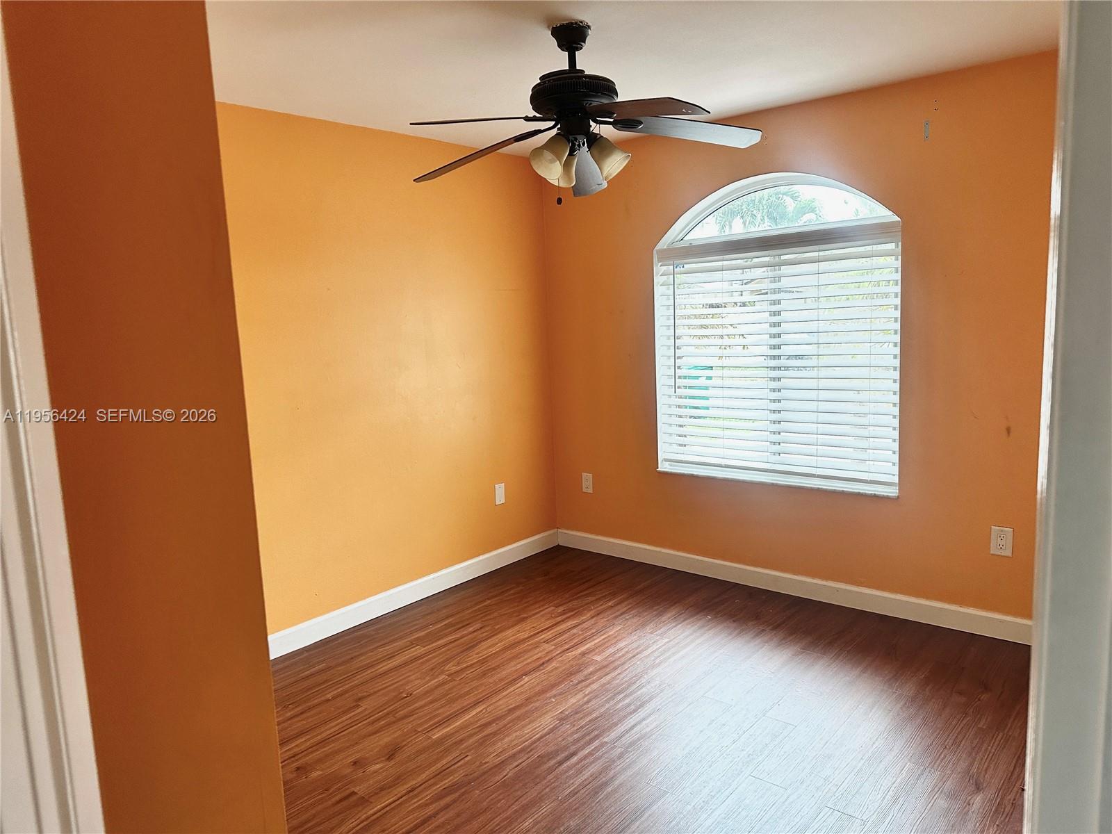4249 Southwest 154th Avenue Miami, FL 33185 - Photo 19 of 24 wooden floor in an empty room with a window