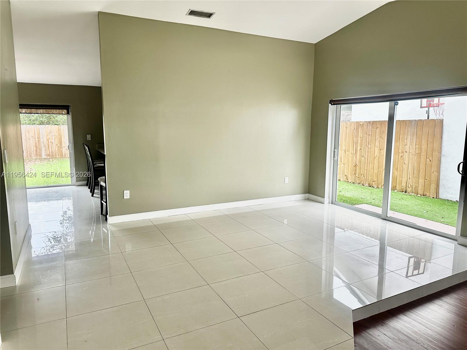 4249 Southwest 154th Avenue Miami, FL 33185 - Photo 2 of 24 a view of an empty room with a window