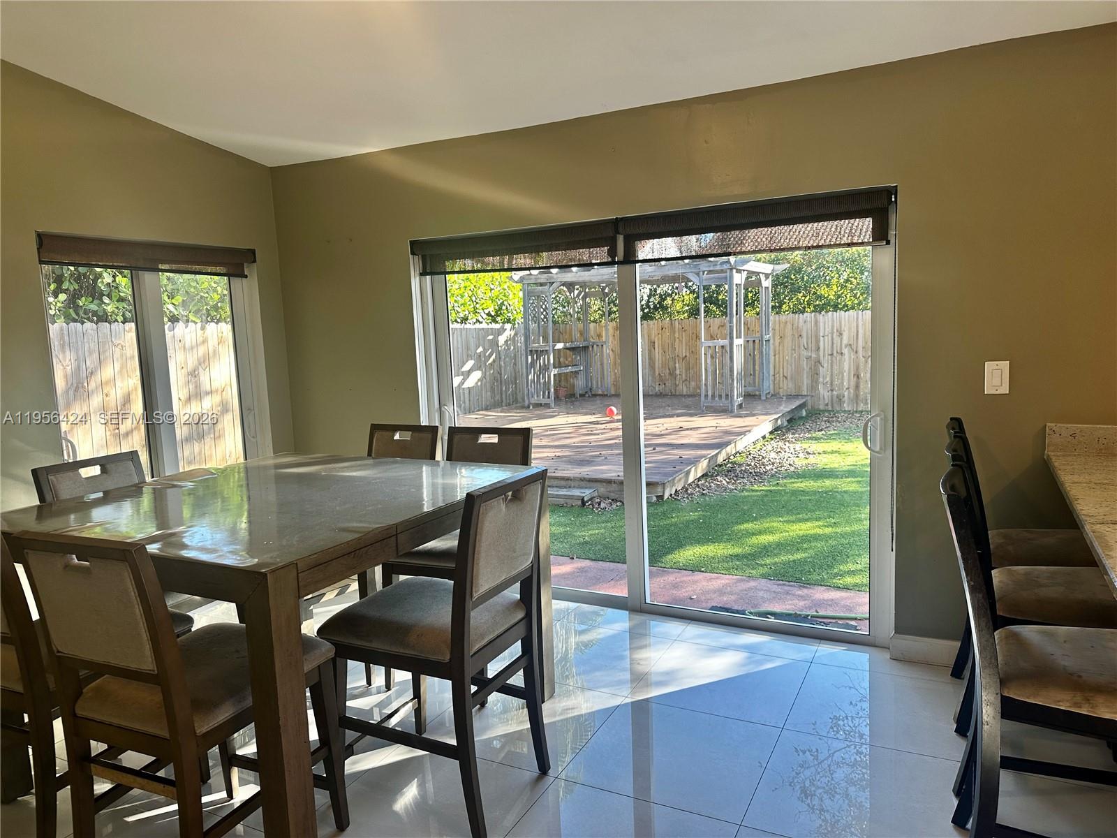 4249 Southwest 154th Avenue Miami, FL 33185 - Photo 8 of 24 a view of a dining room with furniture and wooden floor