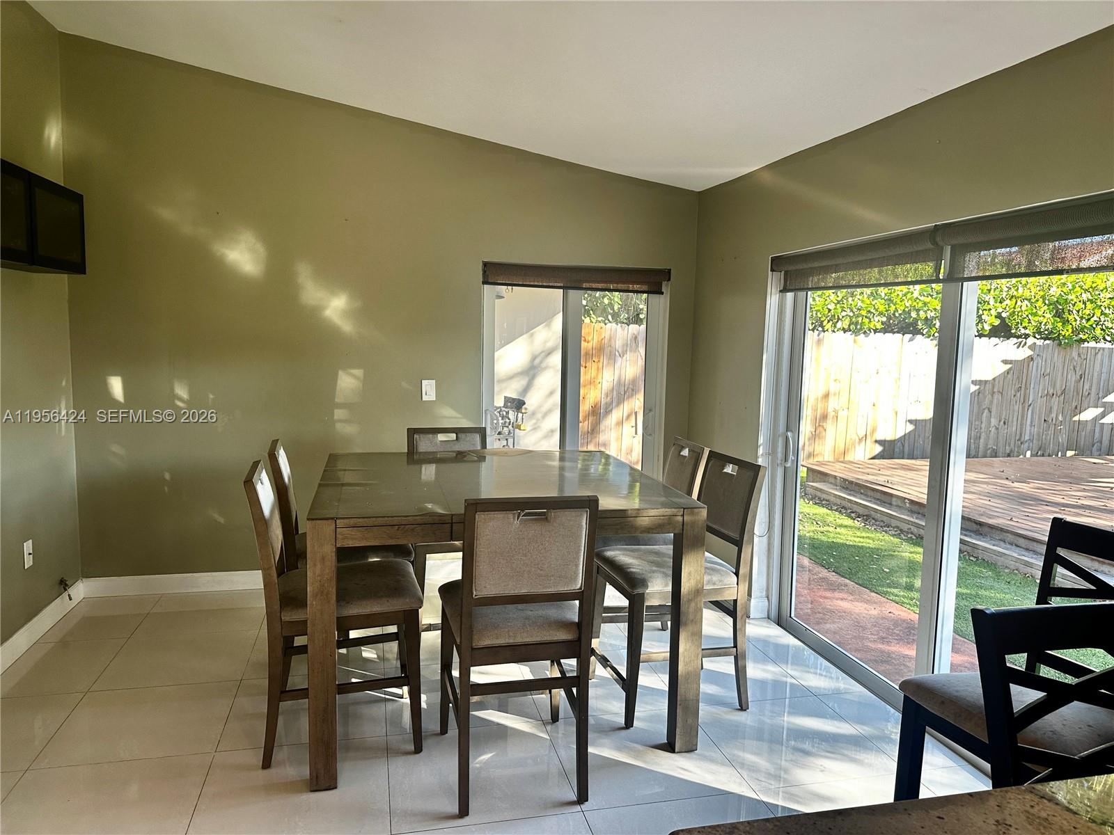 4249 Southwest 154th Avenue Miami, FL 33185 - Photo 9 of 24 a dining room with furniture window and outside view