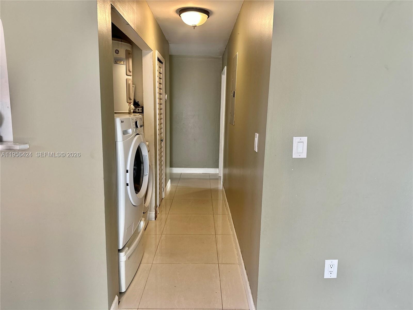 4249 Southwest 154th Avenue Miami, FL 33185 - Photo 10 of 24 a view of a hallway with washer and dryer