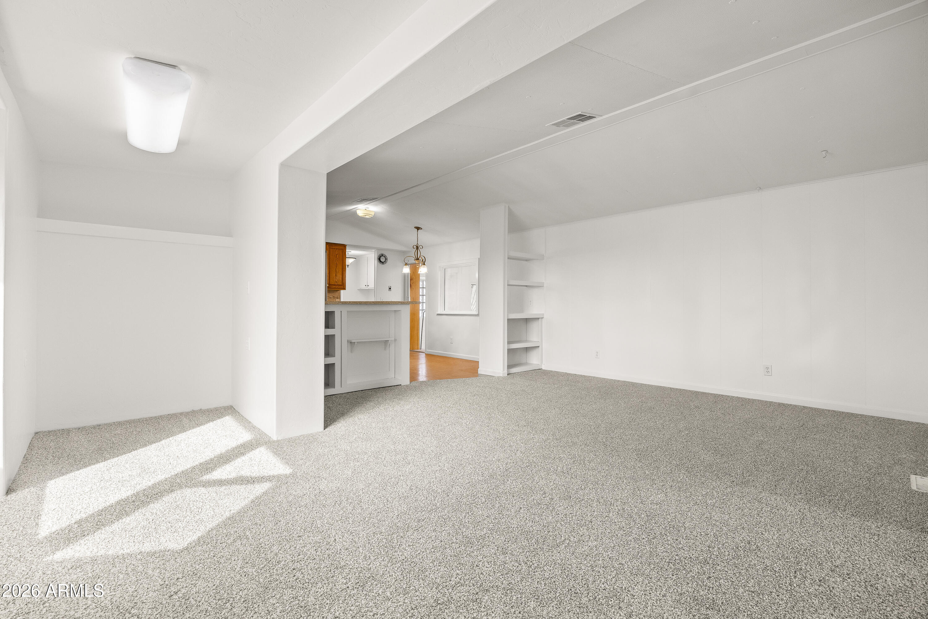 15940 North Goetz Place Tucson, AZ 85739 - Photo 17 of 37 an empty room with a cabinet and mirrors