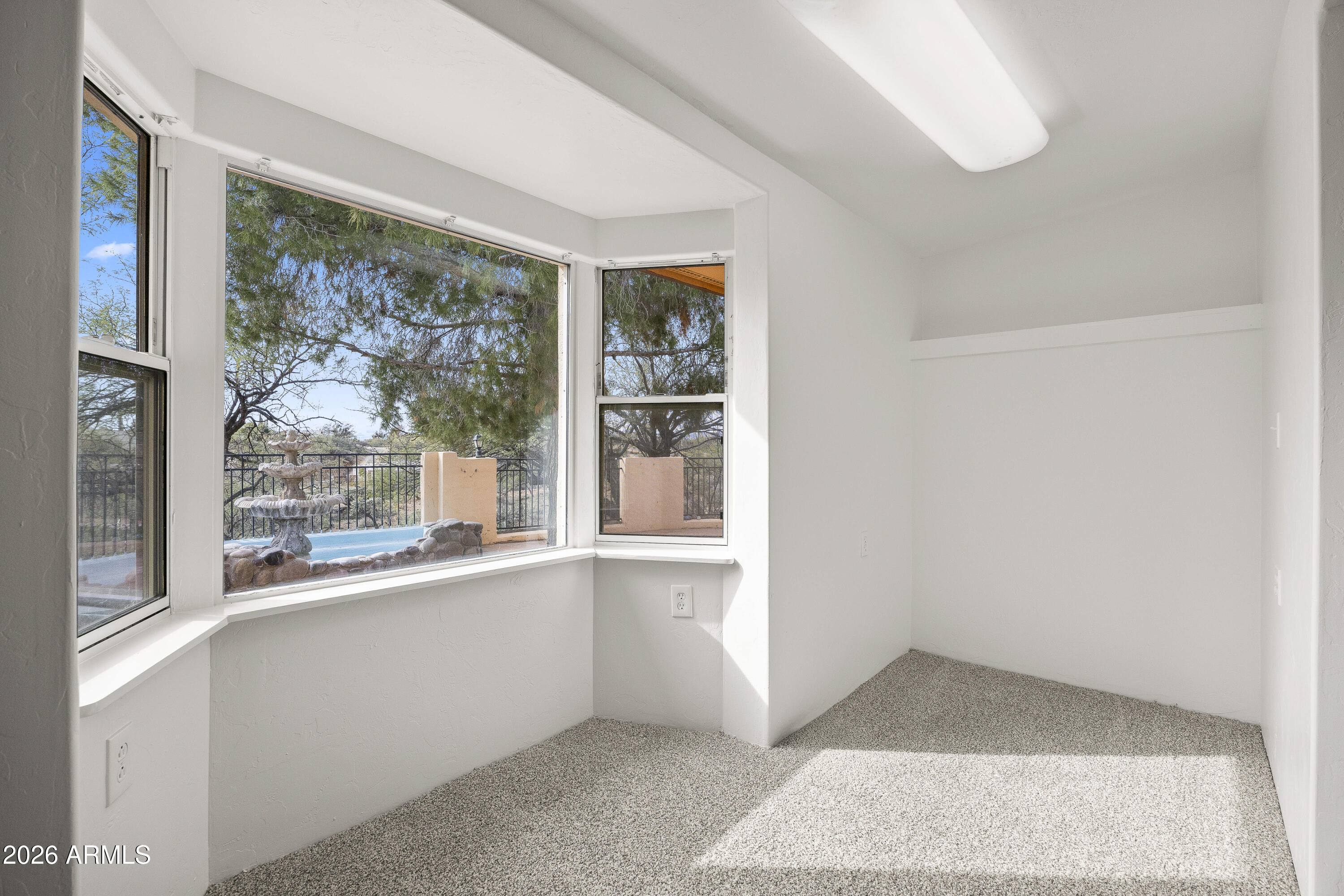 15940 North Goetz Place Tucson, AZ 85739 - Photo 18 of 37 a view of an empty room with a window