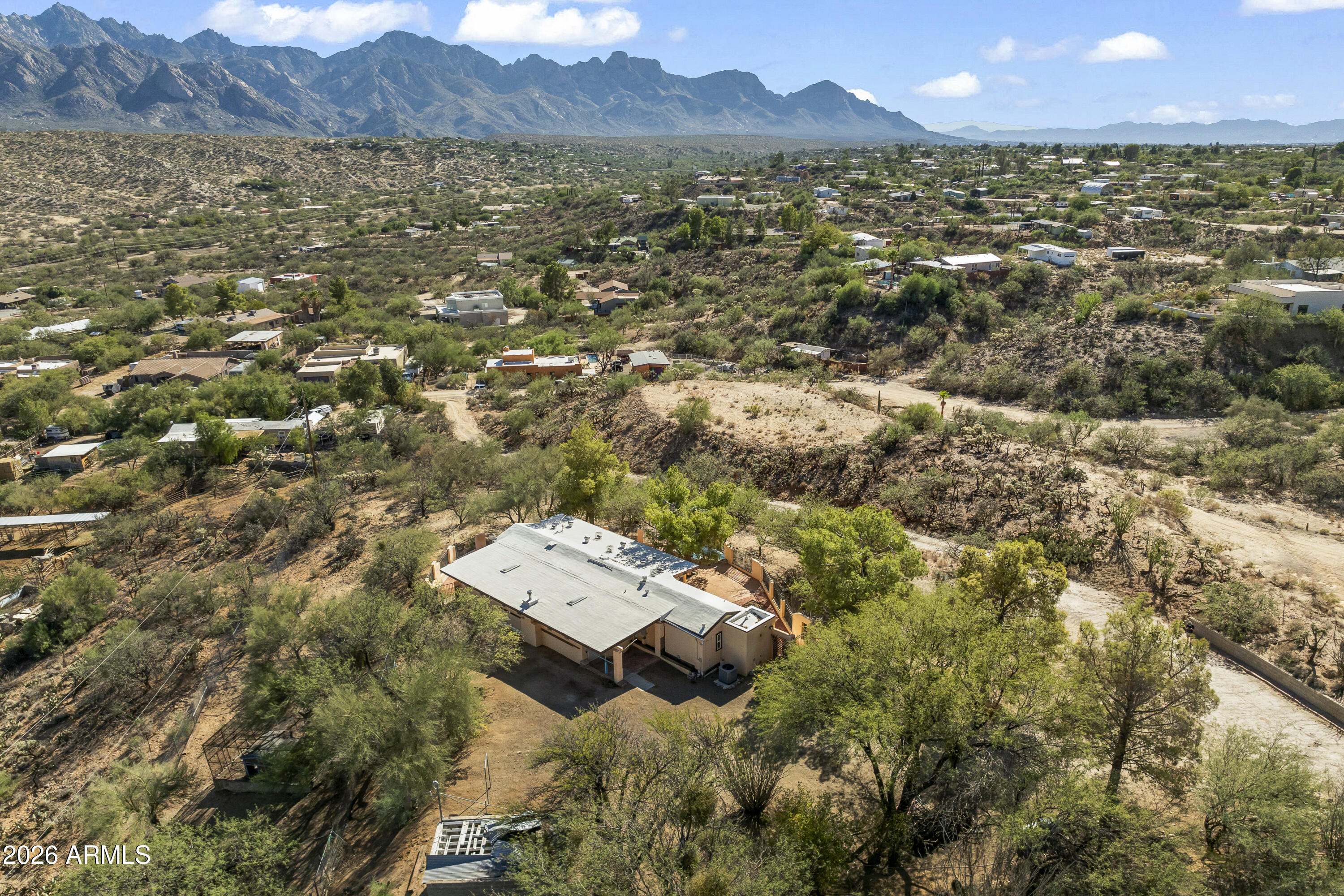15940 North Goetz Place Tucson, AZ 85739 - Photo 2 of 37 a view of a city with mountains in the background