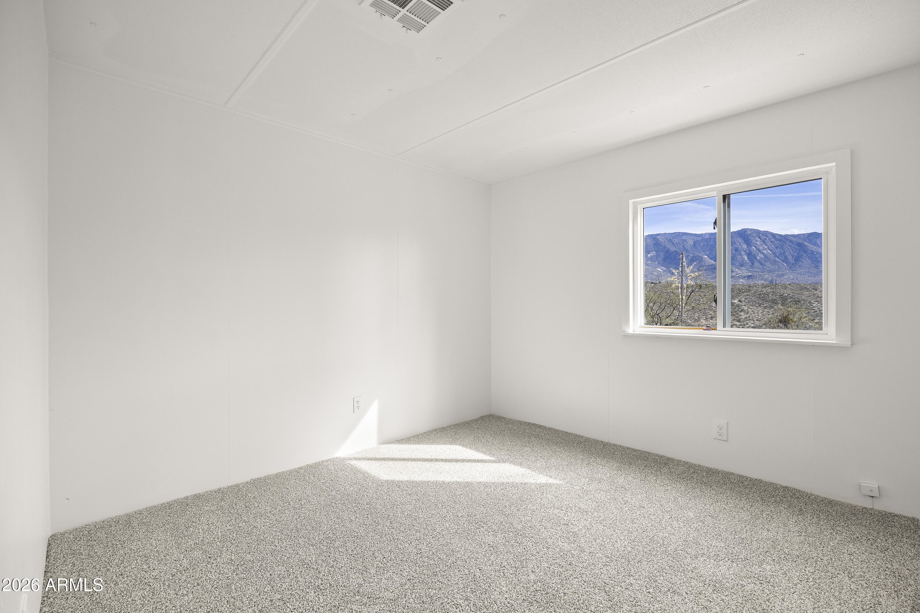 15940 North Goetz Place Tucson, AZ 85739 - Photo 28 of 37 an empty room with a window