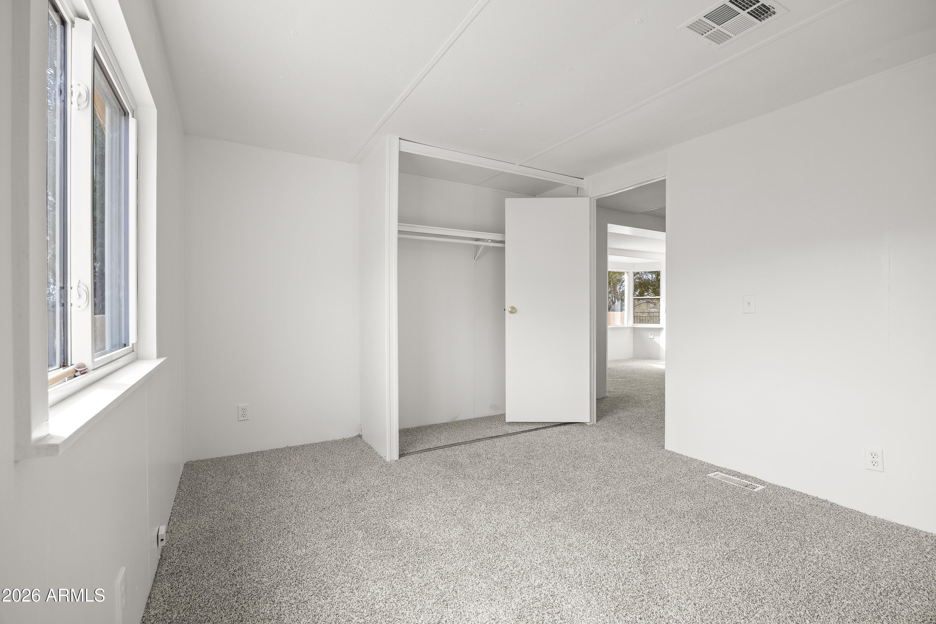 15940 North Goetz Place Tucson, AZ 85739 - Photo 29 of 37 a view of an empty room with a window