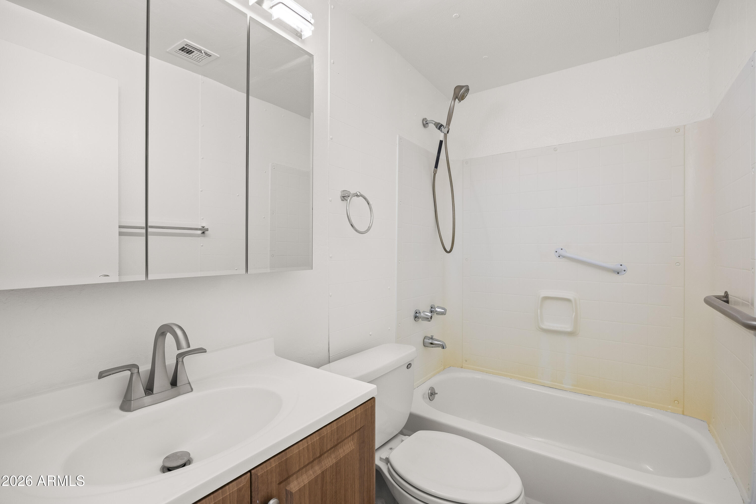 15940 North Goetz Place Tucson, AZ 85739 - Photo 30 of 37 a bathroom with a sink a toilet and a bathtub