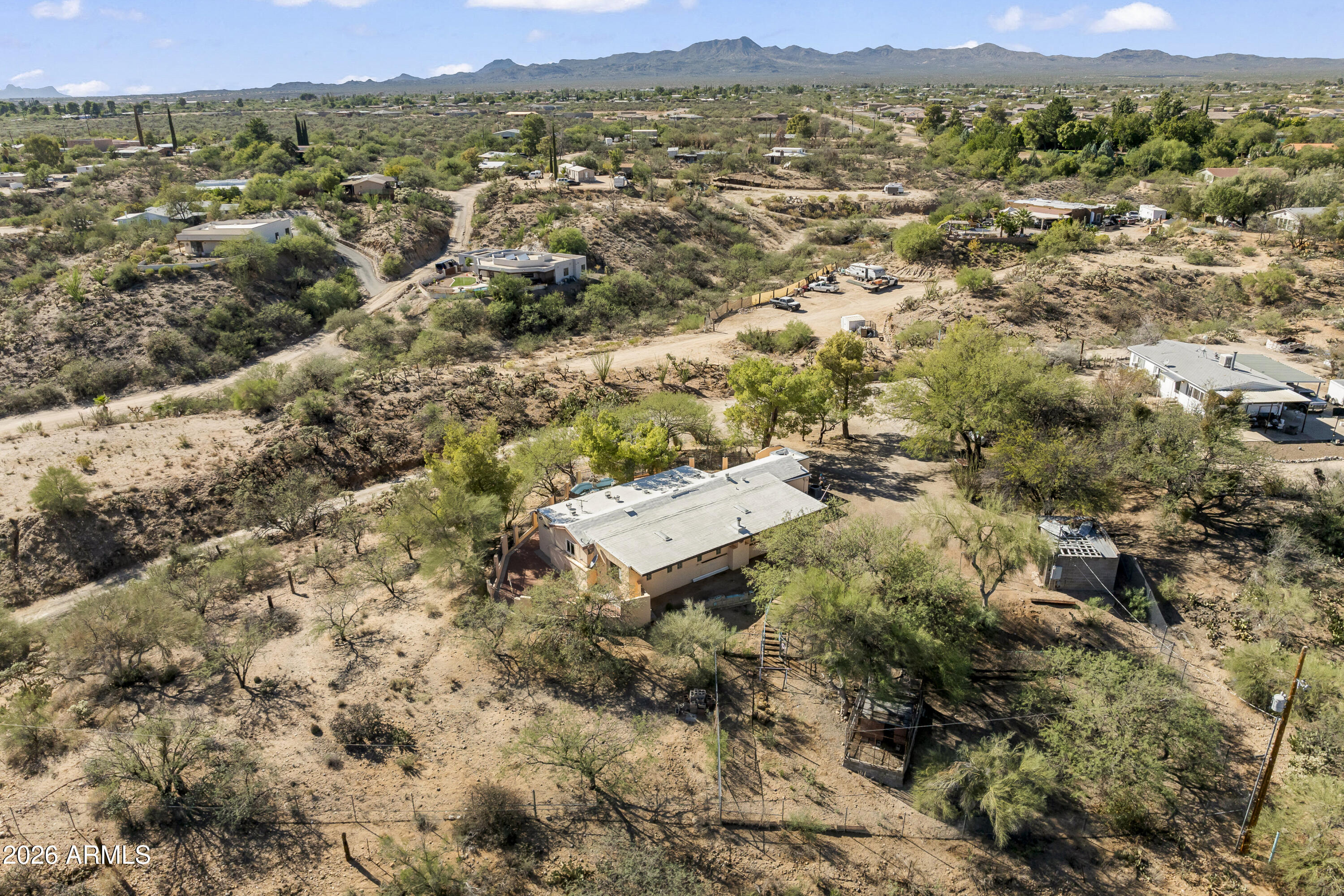 15940 North Goetz Place Tucson, AZ 85739 - Photo 35 of 37 an aerial view of residential house with parking and city view