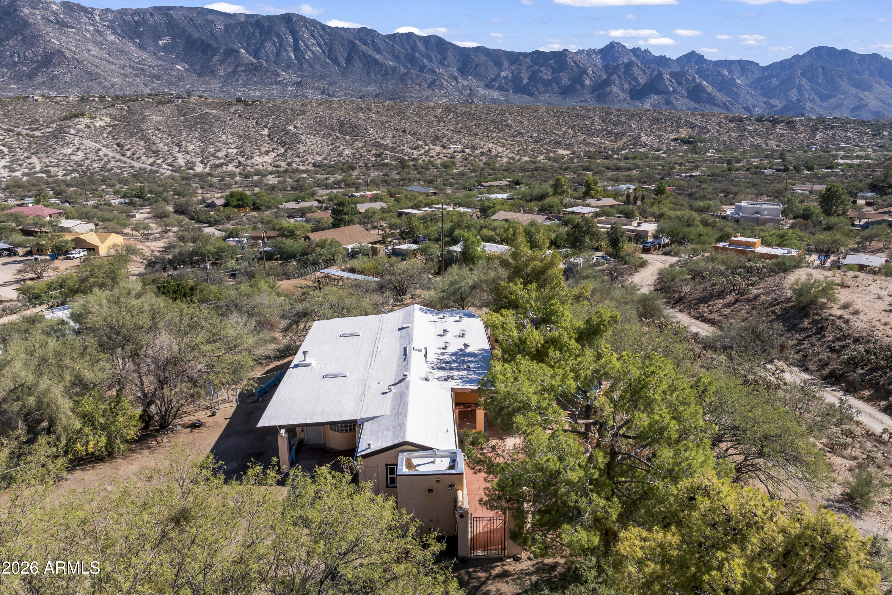15940 North Goetz Place Tucson, AZ 85739 - Photo 37 of 37 an aerial view of house with mountain view